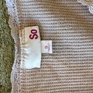 Beige cropped v neck with floral design around neck